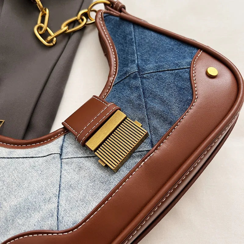Brown denim women's bucket shoulder bag with chain strap and diamond mesh detail.