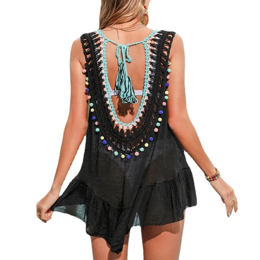 Black women's acrylic beach cover-up vest with hand-crocheting detail, ruffles and a cut-out design.
