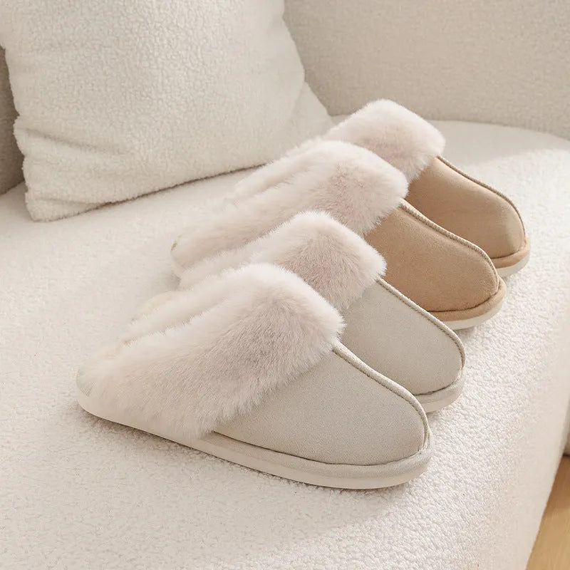 Women's plush-lined indoor slippers with round toe and flat heel in a choice of colours.