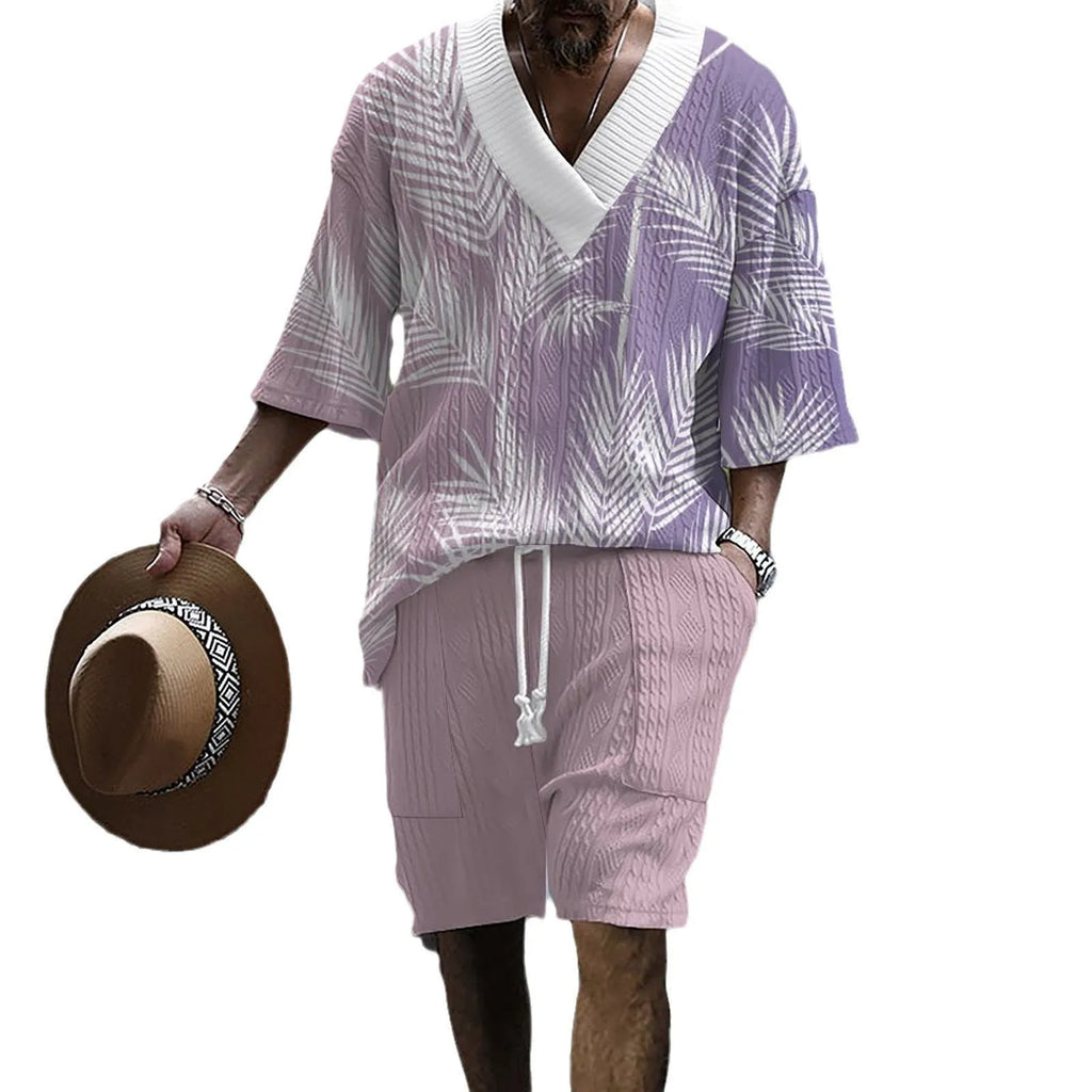 Man wearing a printed drop-shoulder knitted short-sleeve top with matching shorts, a casual summer suit set.