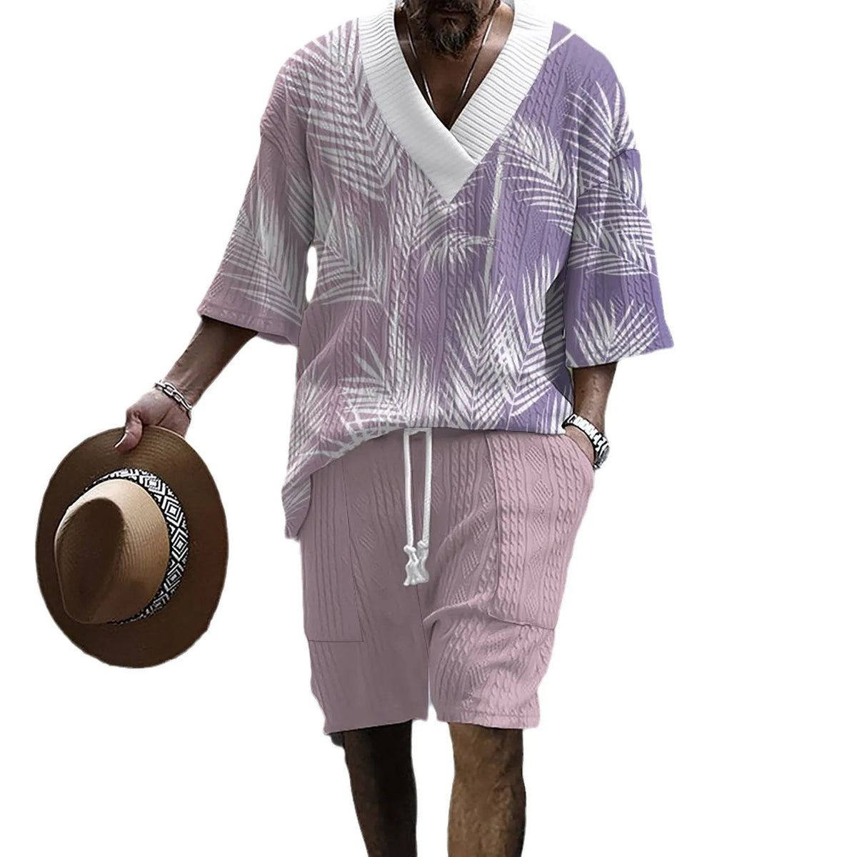 Man wearing a printed drop-shoulder knitted short-sleeve top with matching shorts, a casual summer suit set.