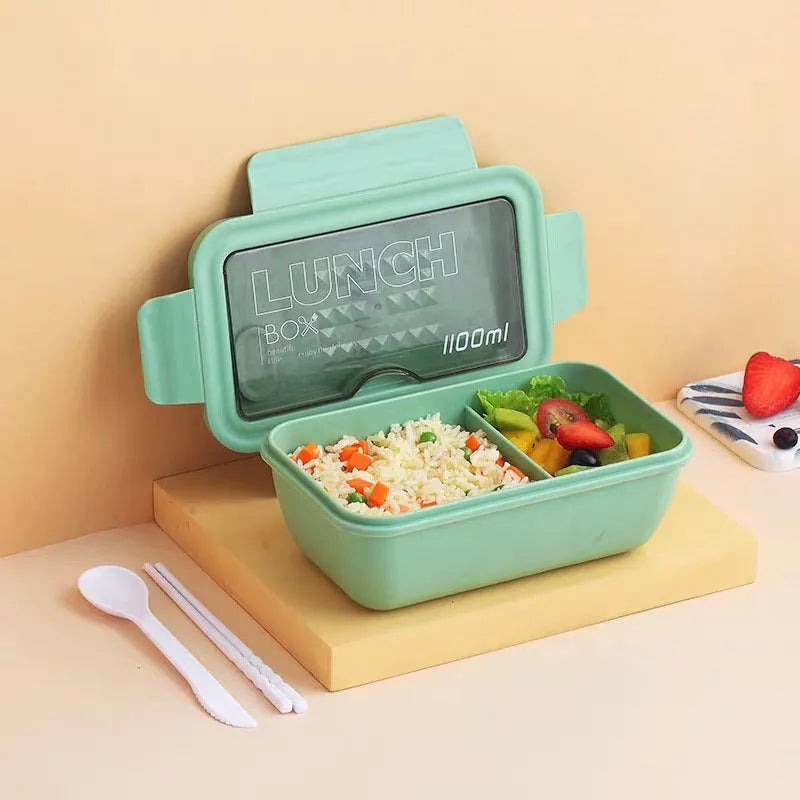 Green partitioned bento box with four compartments showing 20.5 cm plastic lunch container