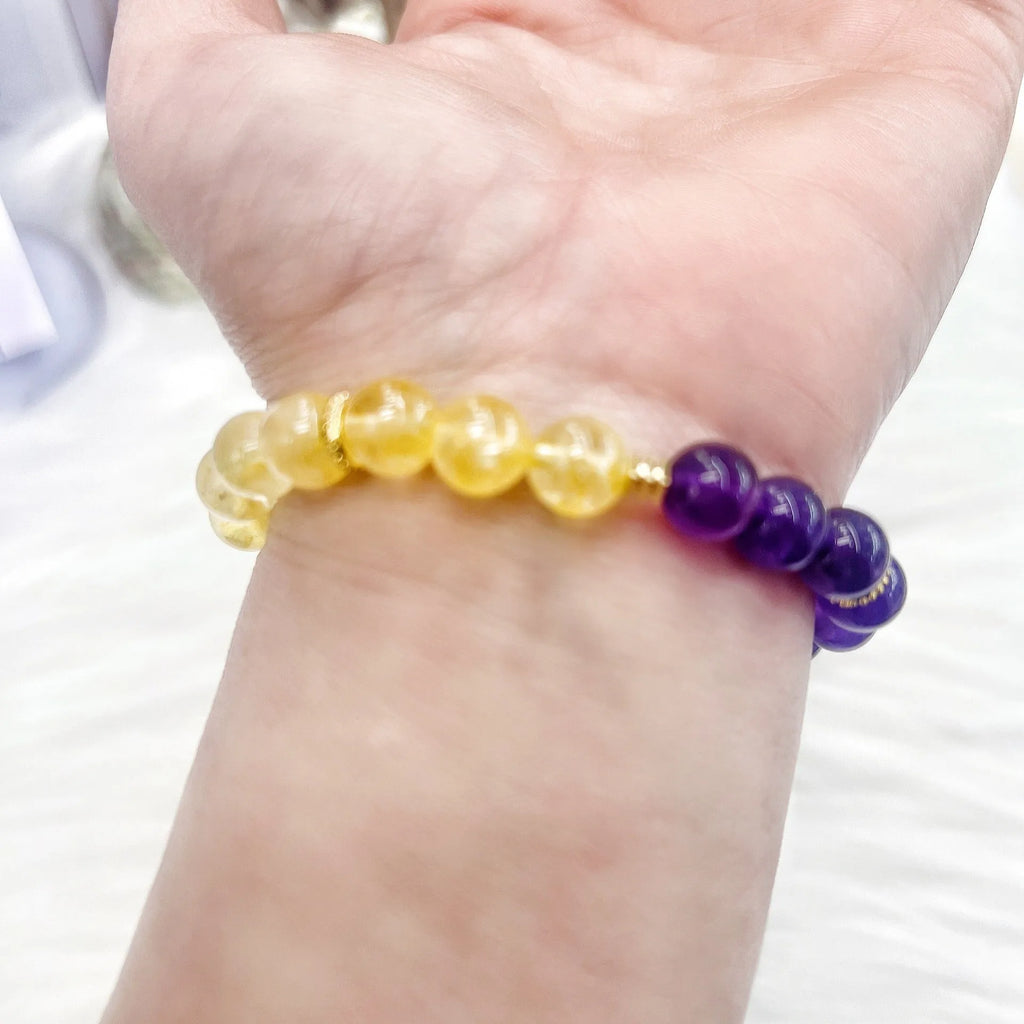 Handmade women's yellow and purple amethyst crystal bracelet with handcrafted details