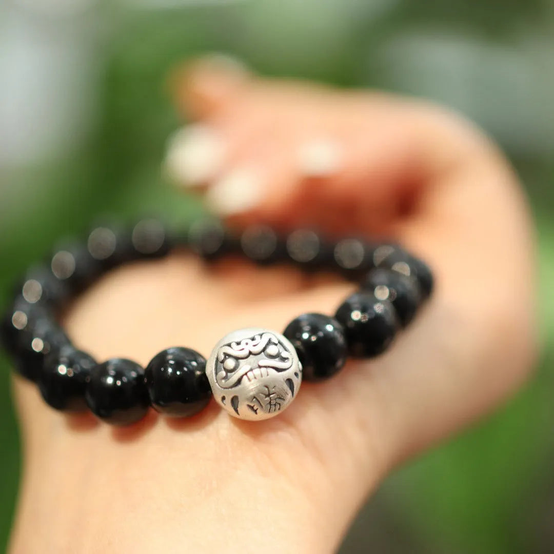Black agate bracelet with sterling silver clasp showing Chinese style design