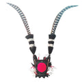 Purple gold crown ornament with long black feathers attached, designed as a motorcycle helmet decoration.