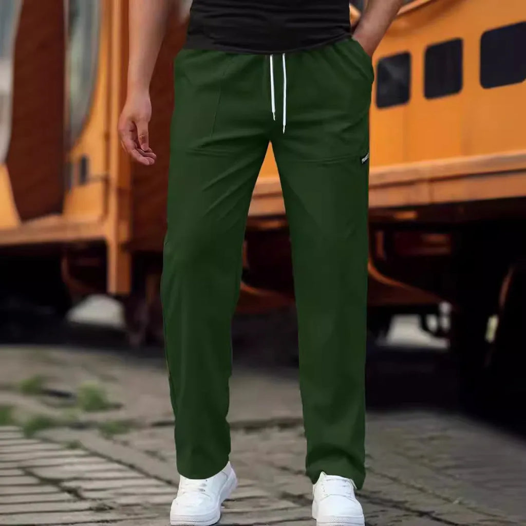 Men's polyester trousers for spring and autumn in light grey colour, showing casual fit.