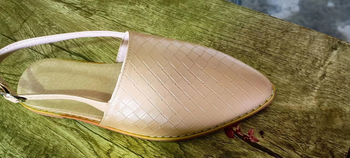 Women's pointed toe buckle flat sandals in microfiber with rubber sole showing buckle closure detail