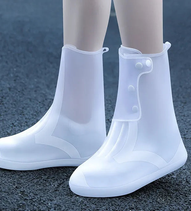 White high-top PVC reusable waterproof shoe cover shown on a foot, with size chart for S to 3XL.