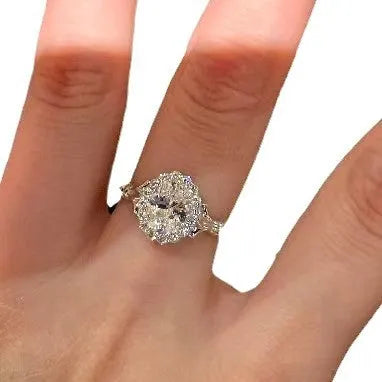 Silver geometric women's ring with large diamond bouquet detail and adjustable opening.