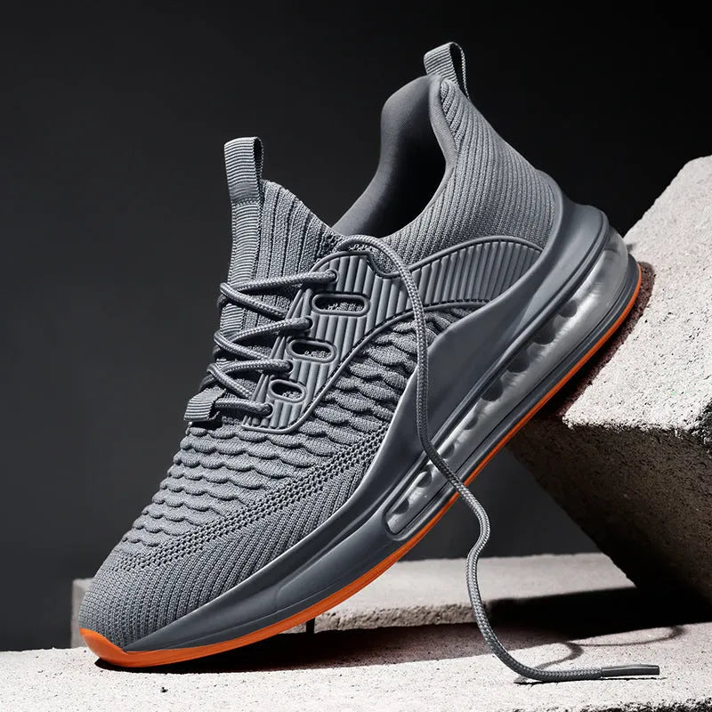 Men's low-top black mesh running sneakers with rubber sole and lace-up front, shown on a white background.
