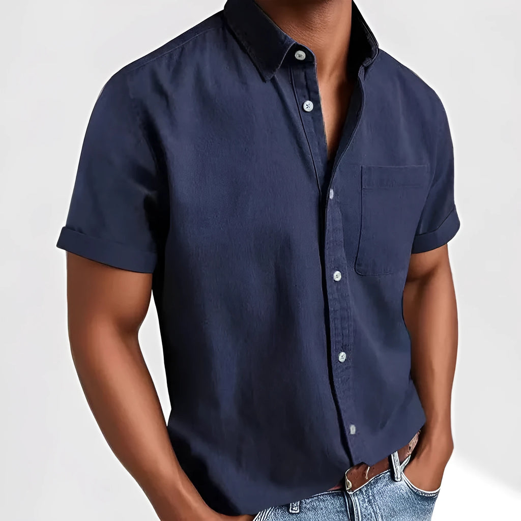 Man wearing a loose-fit grey short-sleeve cotton blend shirt with a single-breasted cardigan style.