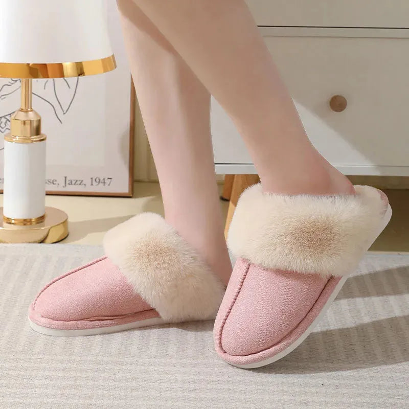 Women's plush-lined indoor slippers with round toe and flat heel in a choice of colours.