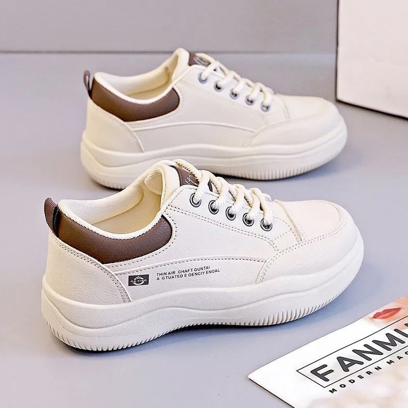 Women's white Korean-style low-top lace-up pumps with cross straps and a round toe.