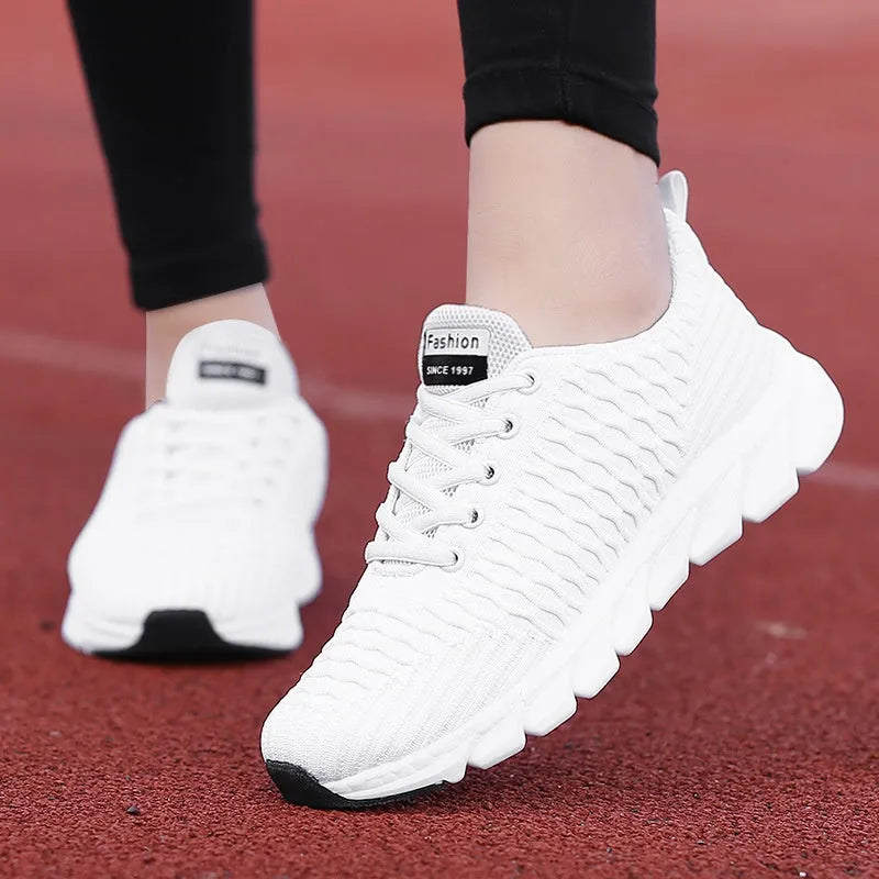 Women's running shoes with fly weaving upper in black, pink or white colours showing breathable construction