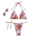 Women's multicolour triangle printed bikini with halter neck top and separate bottoms.