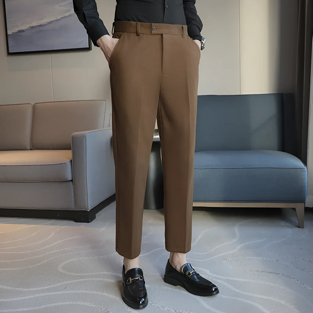 Straight cut brown corduroy trousers with elastic waistband shown front and back views