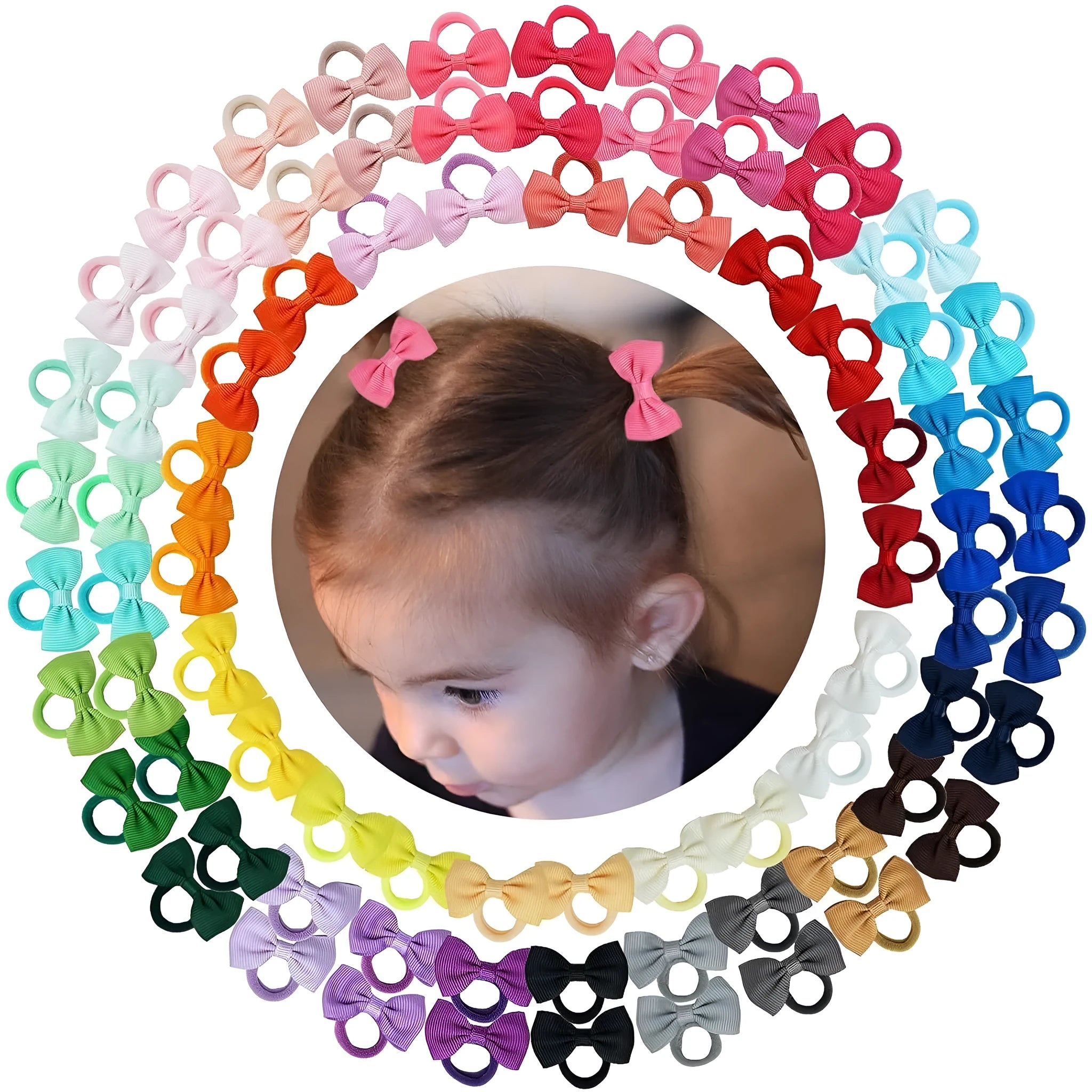 Multi-coloured baby hair ties with small grosgrain ribbon bows, soft elastic bands for infants and toddlers.