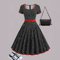 Multicolour polka dot pleated dress with square collar, short sleeves, and a front zipper.