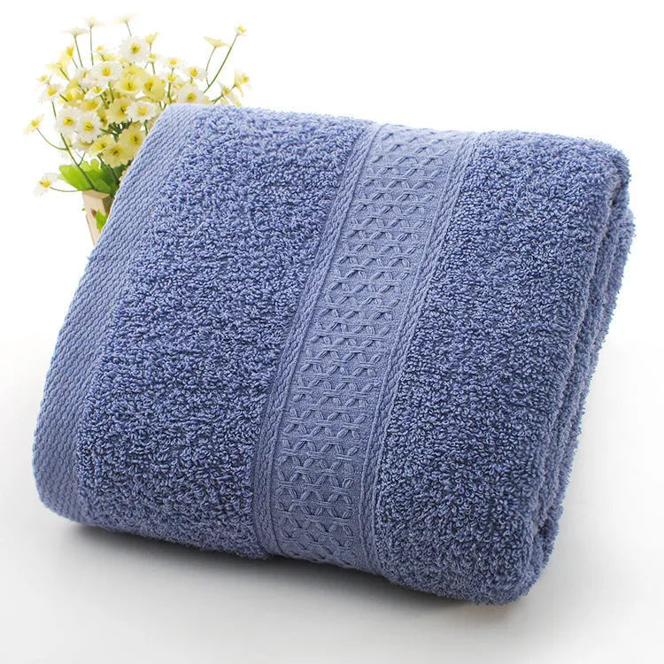 Thickened cotton blend bath and beach towel shown in multiple colour options including green, blue, and pink variations.