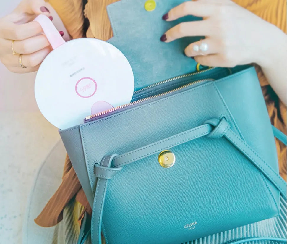Portable UV-C baby bottle steriliser in blue with USB charging cable and compact travel size