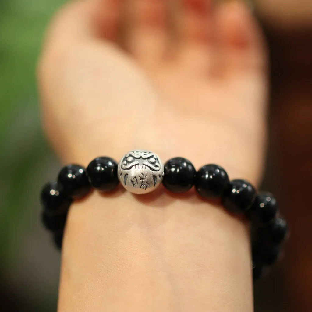Black agate bracelet with sterling silver clasp showing Chinese style design