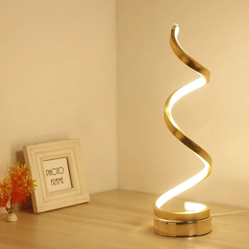 Minimalist black or white LED desk lamp with aluminium shade on a metal base.