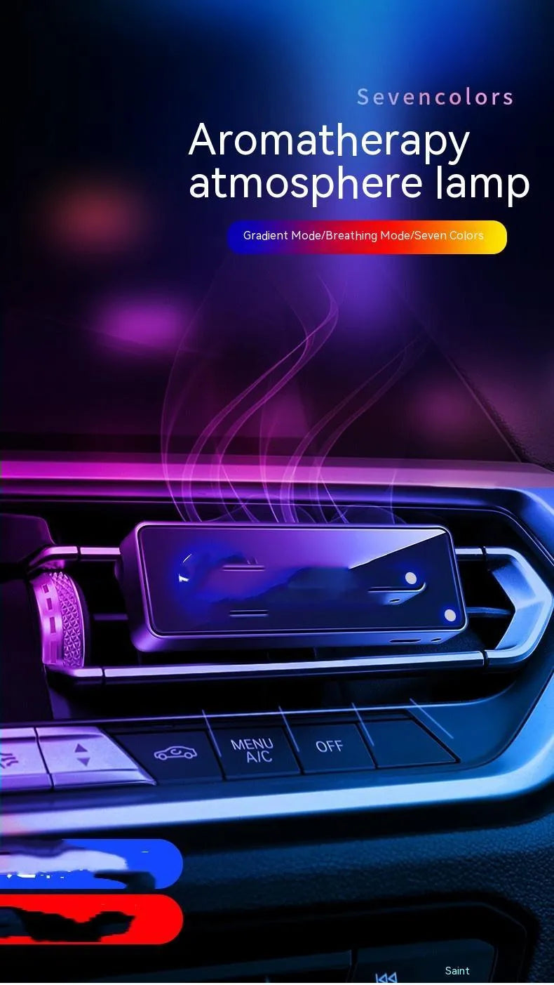 Black automobile aromatherapy air outlet ambience light with LED illumination on car dashboard