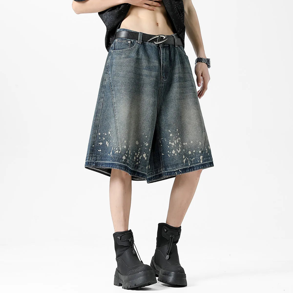 Men's straight cut denim shorts with retro blue wash and ripped splash ink details