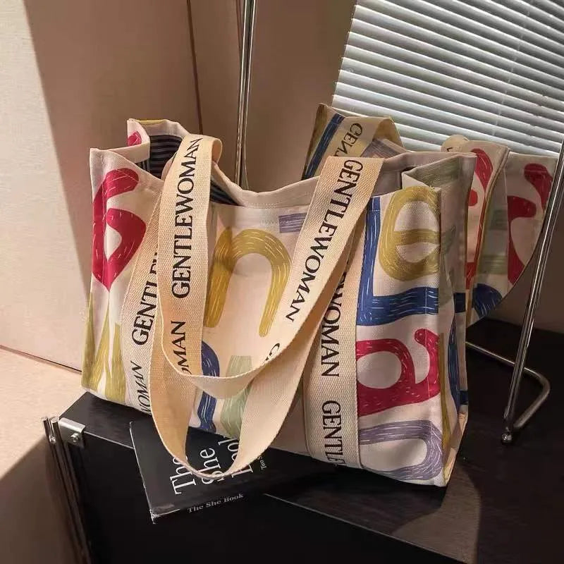 Canvas women's travel tote shoulder bag with printed design in large capacity format