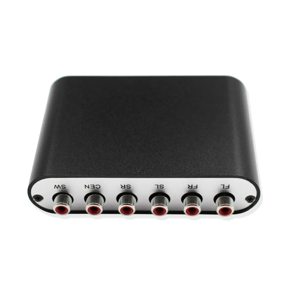 Black DTS Dolby Digital audio decoder with optical and coaxial inputs on a desk