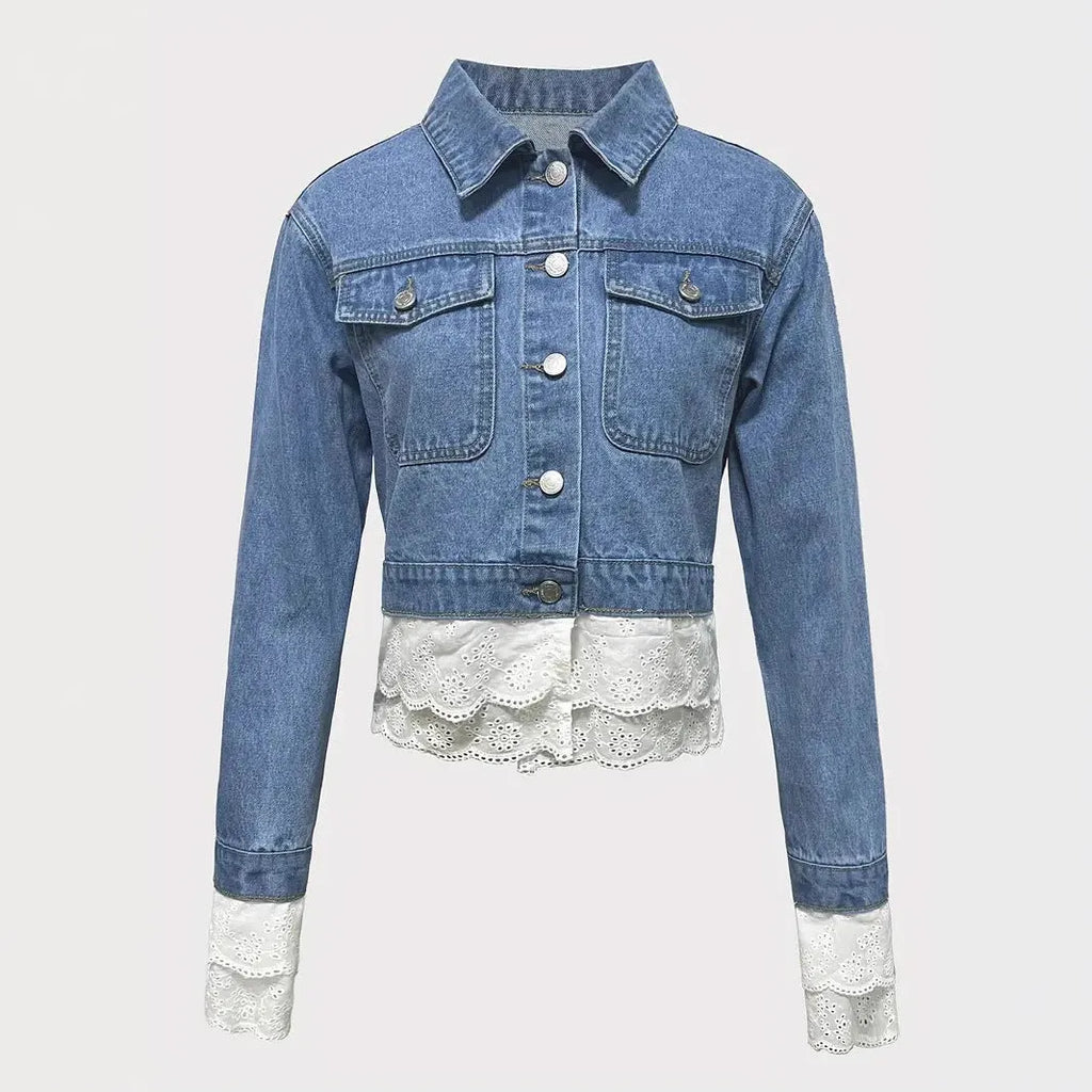 Blue women's denim jacket with decorative lace stitching detail on the front.
