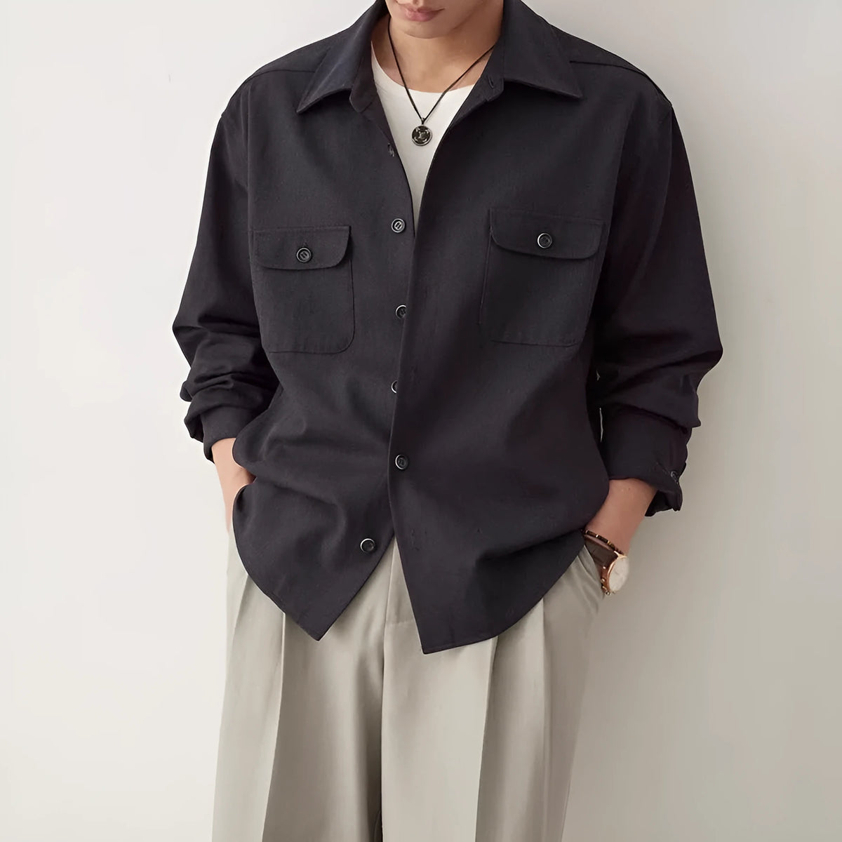 Men's light sand rice coloured long sleeve shirt with a lapel collar, laid flat.