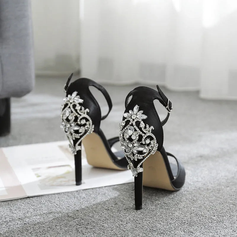Black suede women's high heels with rhinestone detailing and fishmouth toe
