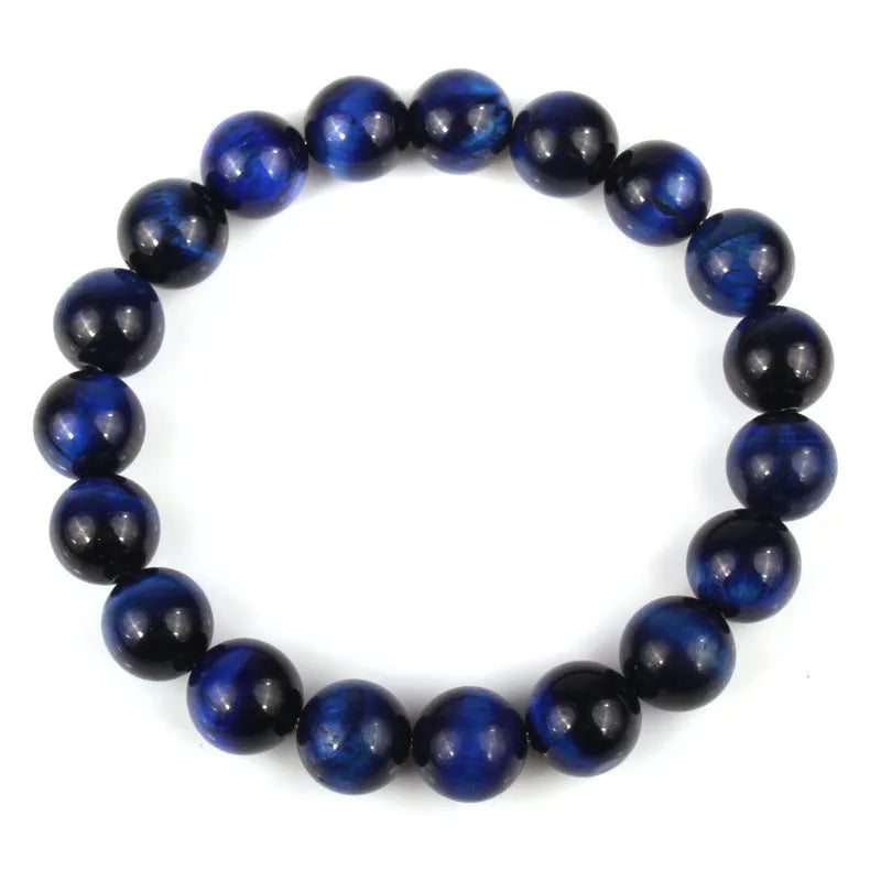 Natural tigereye crystal bracelet with round geometric beads on a wrist
