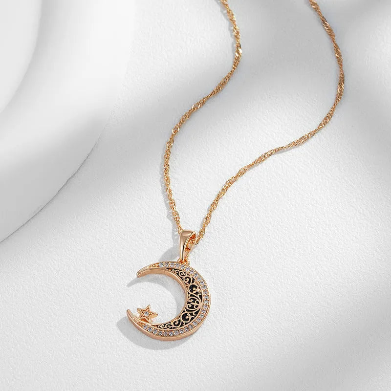 Rose gold necklace with zircon star moon pendant and enamel detailing on adjustable water wave chain