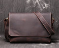 Vintage brown leather mens messenger bag with a flap opening and adjustable shoulder strap.