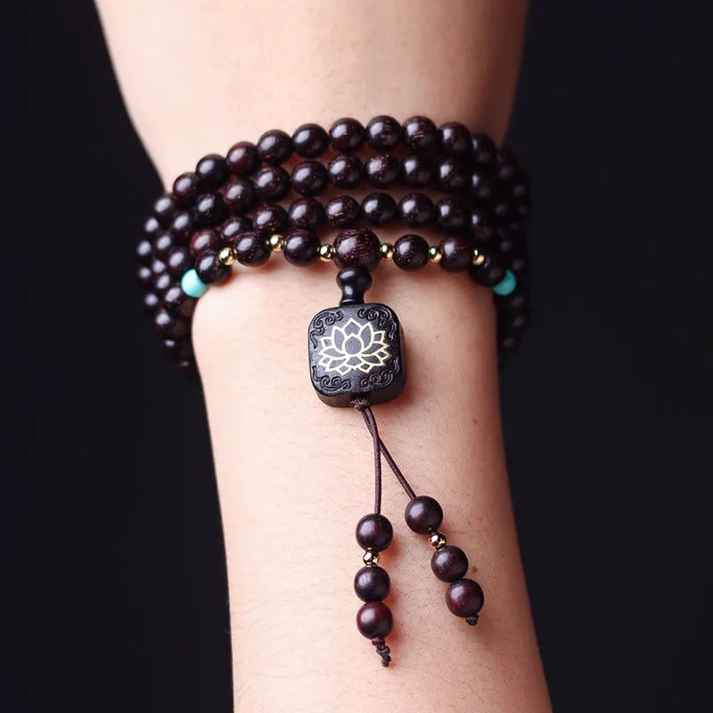 Zambian rosewood bead bracelet with flat lotus pendant showing 108 individual 0.6cm wooden beads