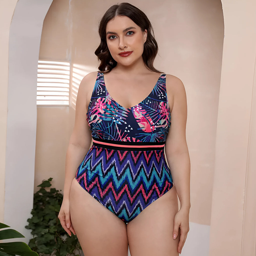 Women's striped vest one-piece swimsuit with spaghetti straps and floral print on blue background.