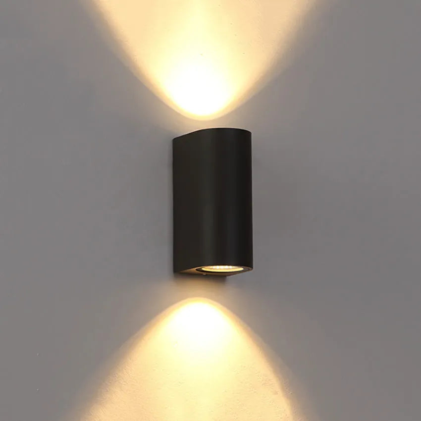Black aluminium wall lamp with silicone rubber trim and glass elements