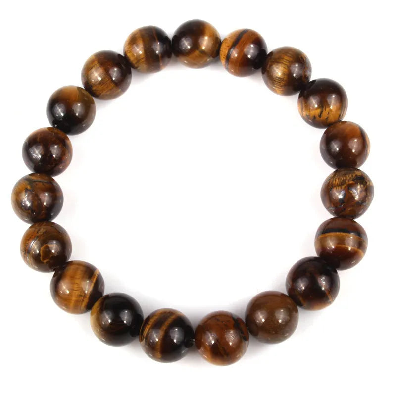 Natural tigereye crystal bracelet with round geometric beads on a wrist