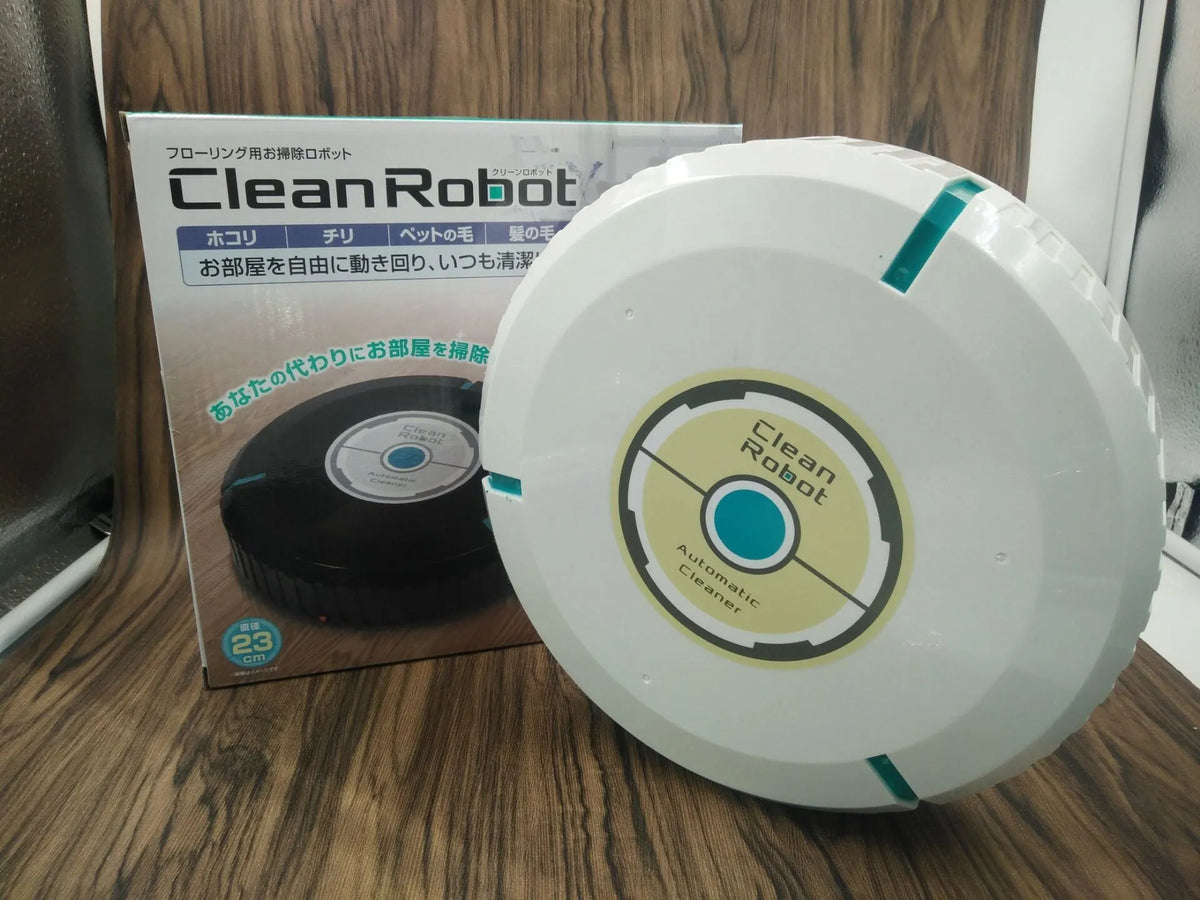 Black and white AC automatic sweeping robot cleaner on a hardwood floor.