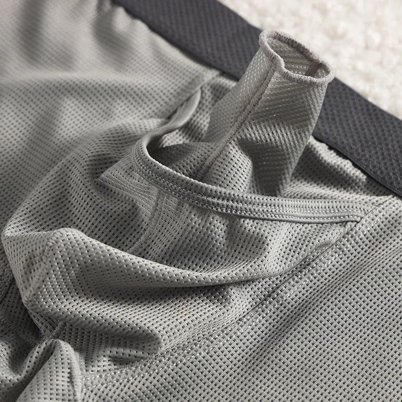 Men's ice silk mesh boxer briefs in black, white, and grey colours showing low waist design