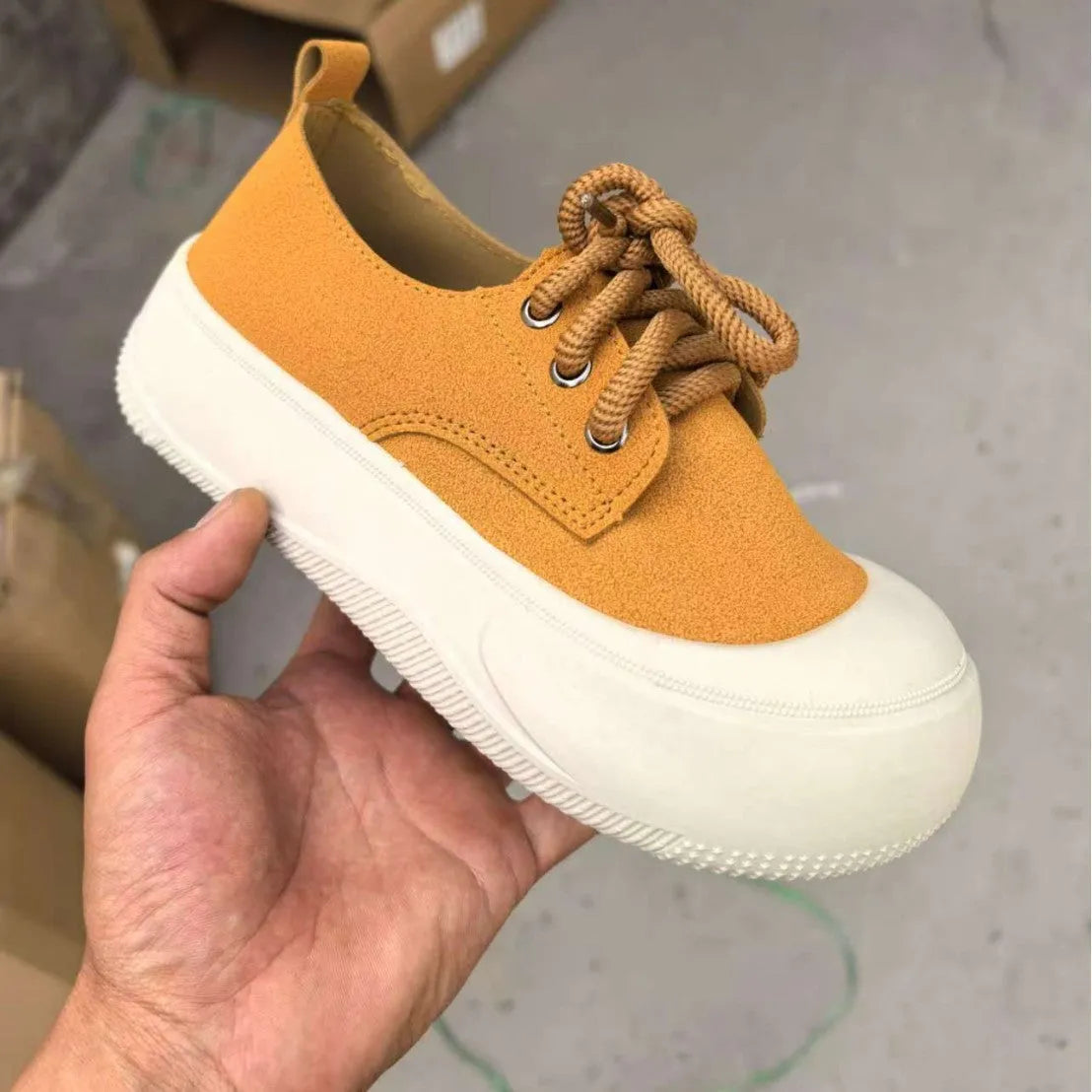 Women's camel suede platform loafers with round toe, flat heel, and front lace-up.