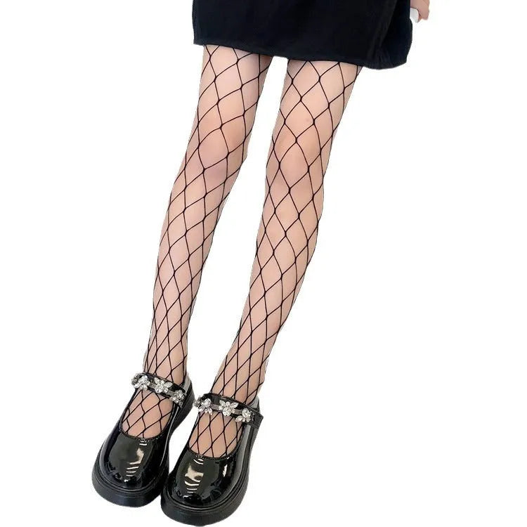 Women's black and white mesh stockings showing large, medium, and small net patterns on a leg.