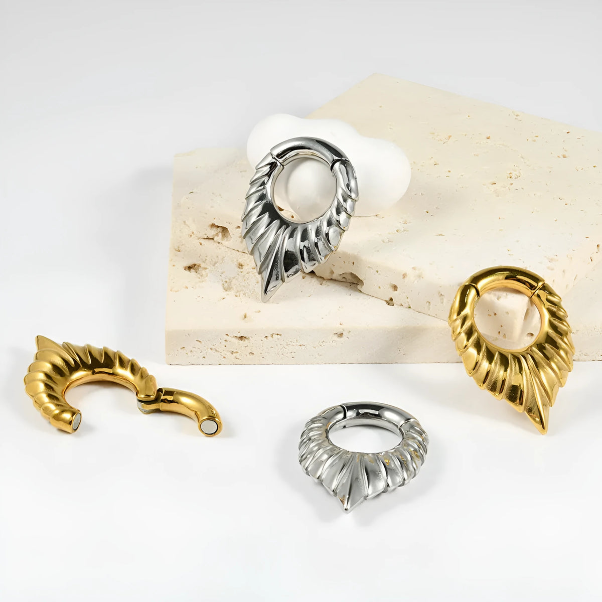 Stainless steel ear extender with drop-shaped auricle design and totem patterns in silver tone