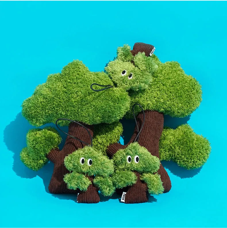 Pine tree-shaped cat chew toy with a dangling pendant, shown in three sizes.