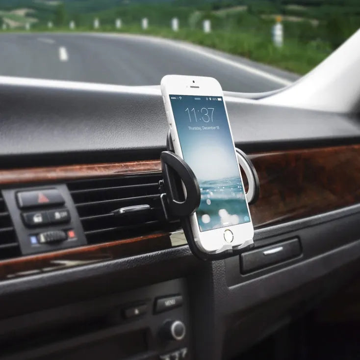 Black car air vent mobile phone holder mounted on vehicle air conditioning outlet