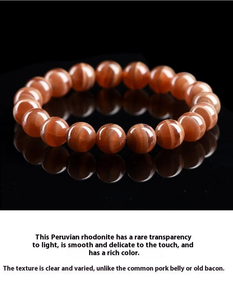 Natural Old Mine Rhodochrosite round bead bracelet from Peru showing pinkish-red mineral colour