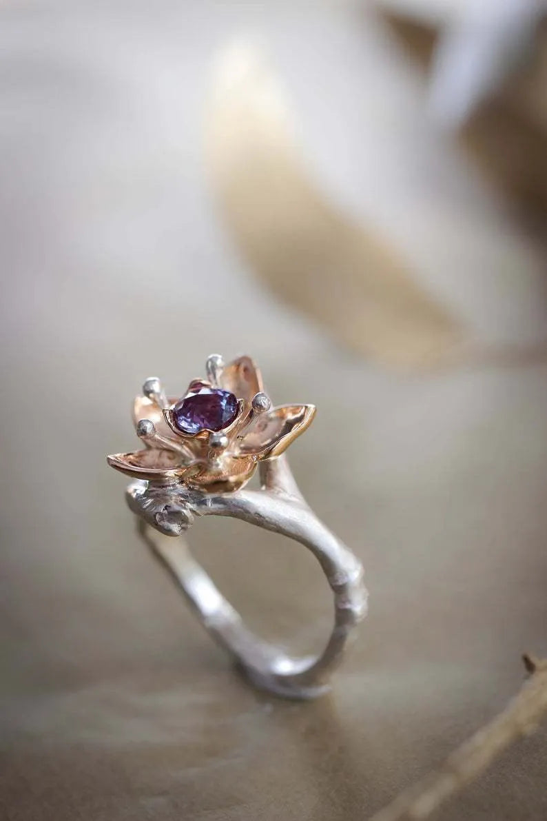 Silver two-tone floral geometric alloy ring showing detailed patterning