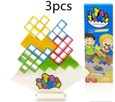 Plastic balance stacking board game with 16 coloured blocks, chassis, and base on a table
